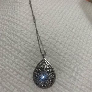 Long silver necklace with different color gems on each side